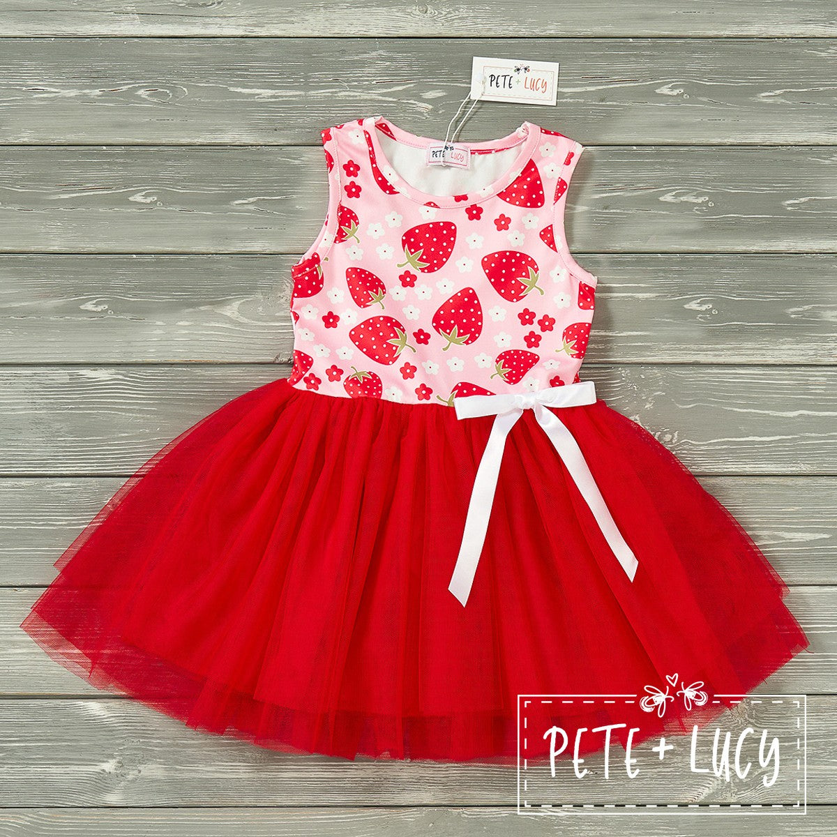 Pink and red tulle dress with a strawberry print on the top